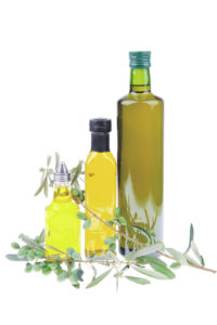 green olives with gold oil over white
